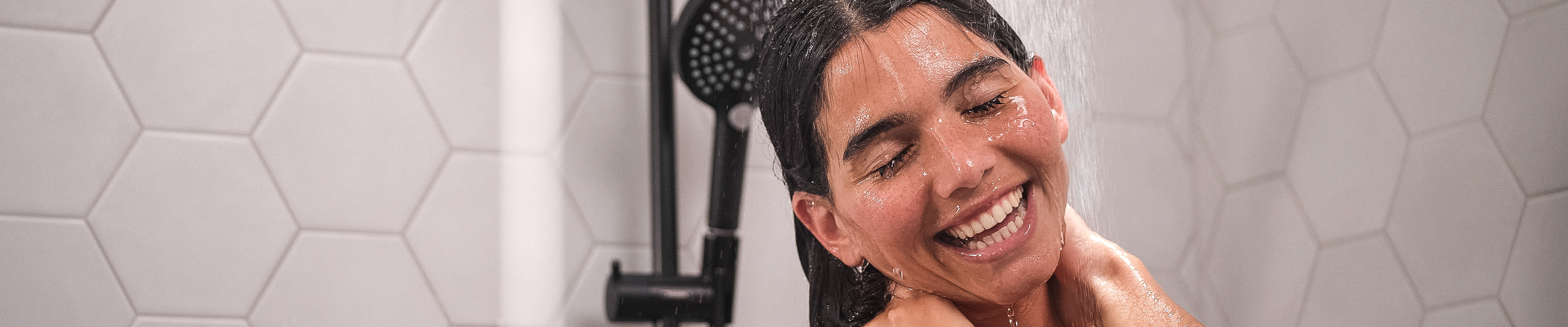 Man tests hansgrohe shower.